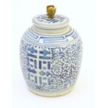 A table lamp, the body formed from an Oriental blue and white ginger jar and cover. The whole