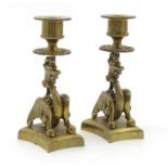 A pair of late 19thC brass candlesticks with winged dragon detail. Approx. 5 1/2" (2) Please