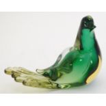A studio art glass model of a bird. Approx 4 1/2" long Please Note - we do not make reference to the
