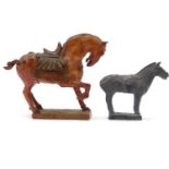 An Oriental plaster model of a tang horse with polychrome decoration on a rectangular base, with