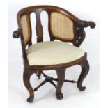 A 19thC mahogany Bürgermeister chair with scrolled carved arms, double caned
