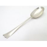 Silver rat-tail dessert spoon with unusual shaped handle. Hallmarked Sheffield 1929 maker William
