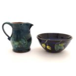 Two items of Irish studio pottery comprising a bowl decorated with stylised lemons and foliage,