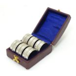A cased set of 6 silver plated napkin rings Please Note - we do not make reference to the