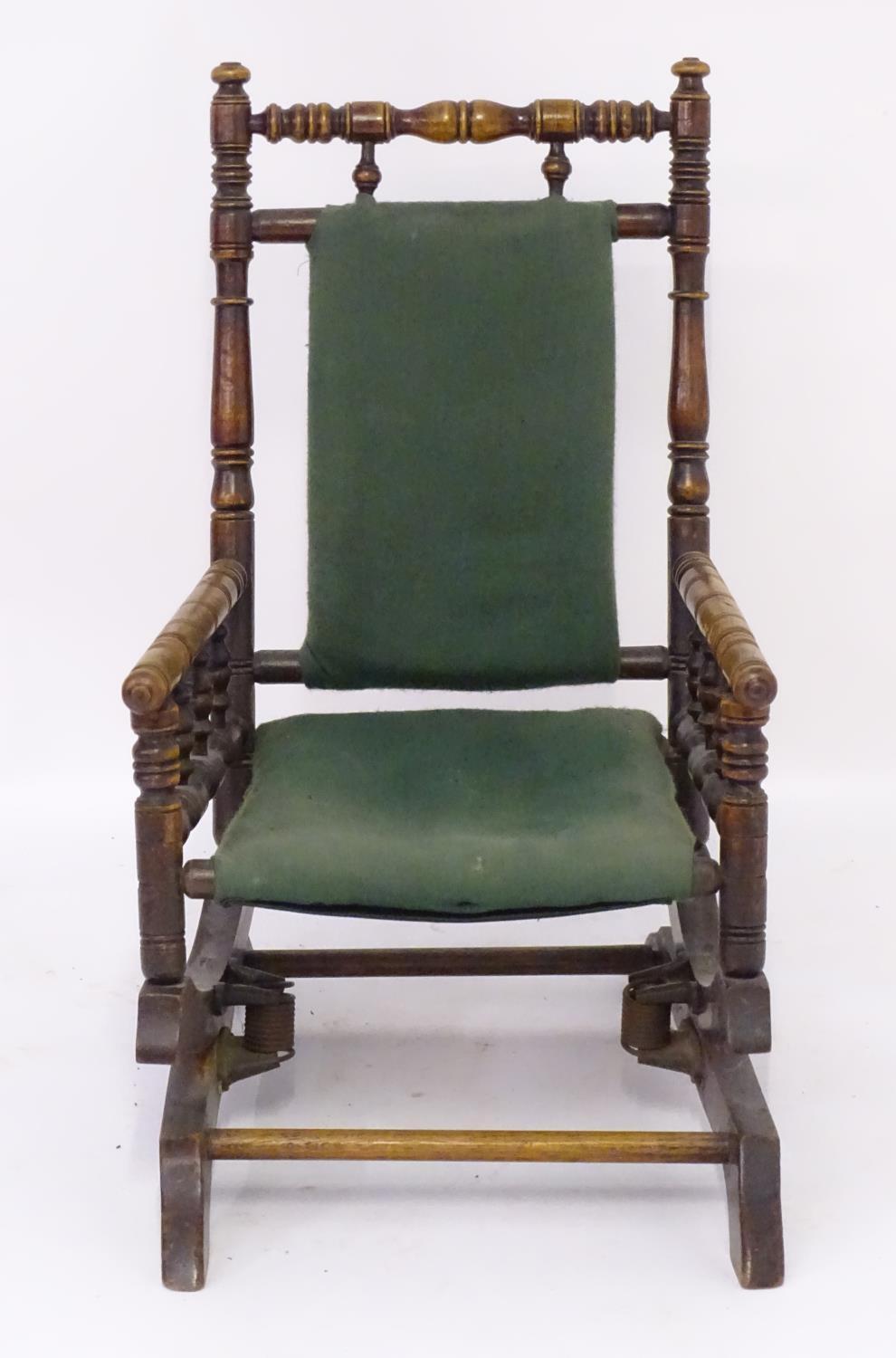 An early 20thC childs rocking chair with a ring turned frame above a cloth seat and turned spindle - Image 3 of 4