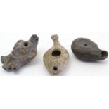 Three Roman style oil lamps, one with face detail. Largest approx. 4 1/4" (3) Please Note - we do