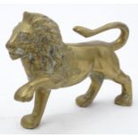 A Victorian brass model of a prowling lion. Approx. 6" x 8" Please Note - we do not make reference