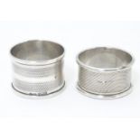 Two silver napkin rings, both with engine turned decoration. One hallmarked Birmingham 1955 maker