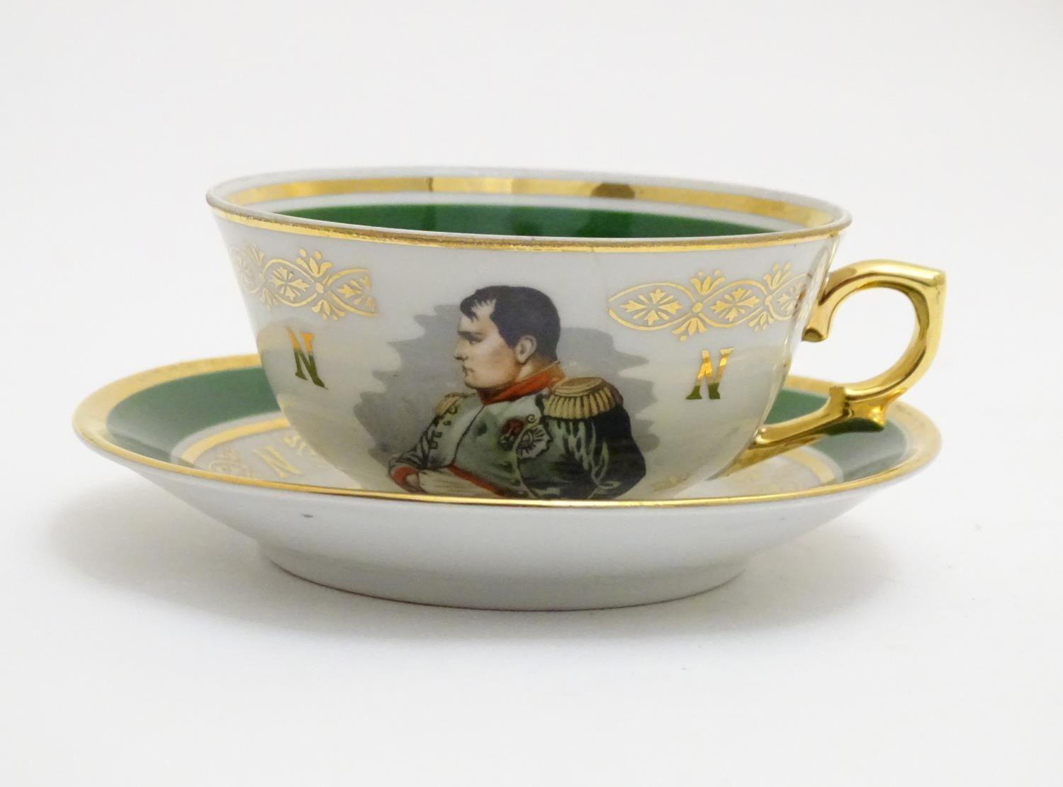 A French tea cup and saucer depicting Emperor Napoleon with green and gilt highlights. Porcelaine de - Image 2 of 10