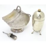 A silver plate sugar scuttle of coal scuttle form together with a sugar shaker / caster of bullet