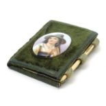 A 19thC folding sewing / needle case with applied cabochon depicting an alpine boy. Approx. 3 1/4" x