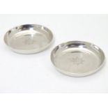 Military Interest: A pair of silver coasters with engraved insignia and motto for Brigade of