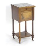 A 19thC rosewood bedside cabinet with a marble top above a single short drawer and marble lined