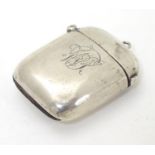 A silver vesta case with hinged lid and striker under. Hallmarked Chester 1903 maker Payton,