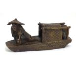 An Oriental bronze model of a fishing boat with a figure fishing. Approx. 6 1/2" long Please