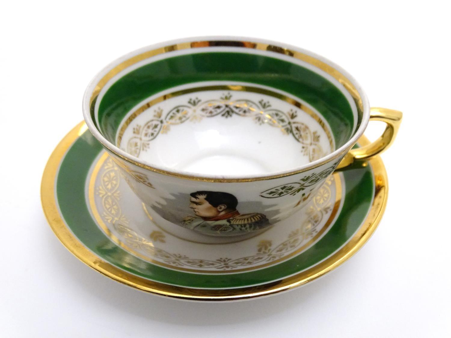 A French tea cup and saucer depicting Emperor Napoleon with green and gilt highlights. Porcelaine de - Image 9 of 10