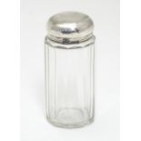 A glass toilet jar with silver top hallmarked London 1901 maker Mappin & Webb Ltd. 3 1/2" high.
