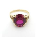 An Irish 9ct gold ring set with central ruby. Dublin c.1975. Ring size approx K 1/2 Please Note - we