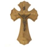An early 20thC wooden crucifix with a cast model of Jesus Christ on the cross below an INRI scroll