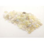 A quantity of unmounted opal cabochons of various sizes. Largest approx. 1/4" long. Total weight