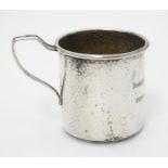 An American Art Deco christening mug with hammered decoration. Marked under with makers mark for