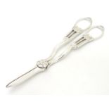 Silver grape shears with scallop shell decoration. Hallmarked Sheffield 1912 maker Harrison Brothers