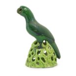 A Chinese model of a parrot with a green glazed on a pierced base. Approx. 12" high Please Note - we