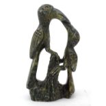 An Oriental soapstone carving depicting two stylised birds on a branch. Approx. 8" high Please
