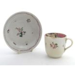 A New Hall tea cup with hand painted floral decoration. Together with a saucer with hand painted