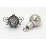 A silver pendant perfume / scent bottle of spherical form with screw lid 1" high. Together with a