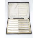 A cased set of silver handled tea / butter knives, hallmarked 1928, maker John Sanderson & Son Ltd