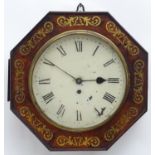 A Regency wall clock, the octagonal shaped rosewood case with inlaid brass detail and having a fusee