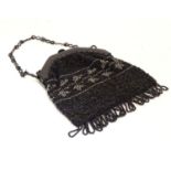 A 20thC bead work bag /purse with banded detail. Approx. 7" Please Note - we do not make reference