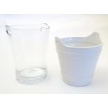 A glass wine cooler / ice bucket together with a white glazed ceramic example. The largest 10 1/2"