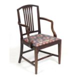 An early 20thC mahogany carver chair with a shaped top rail above a fanned pierced back splat
