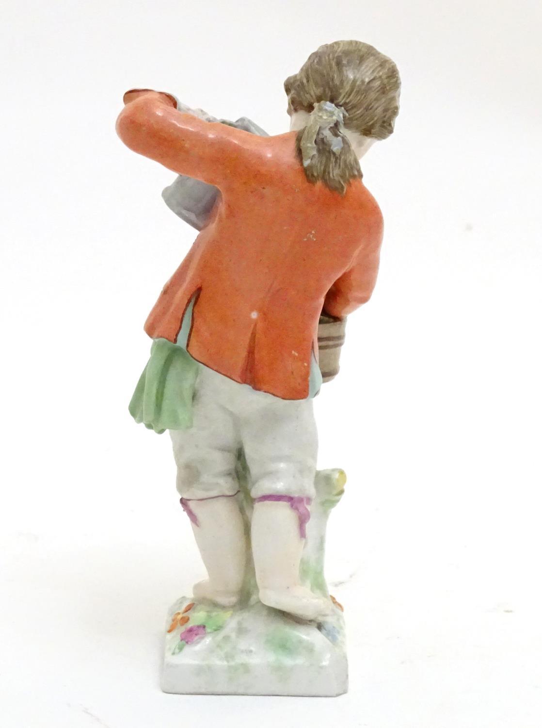 A Continental porcelain figure modelled as a boy with a watering can tending to a pot of flowers. - Image 5 of 6