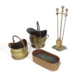 A quantity of late 19th / early 20thC fire tools, comprising two coal scuttles of helmet form, a