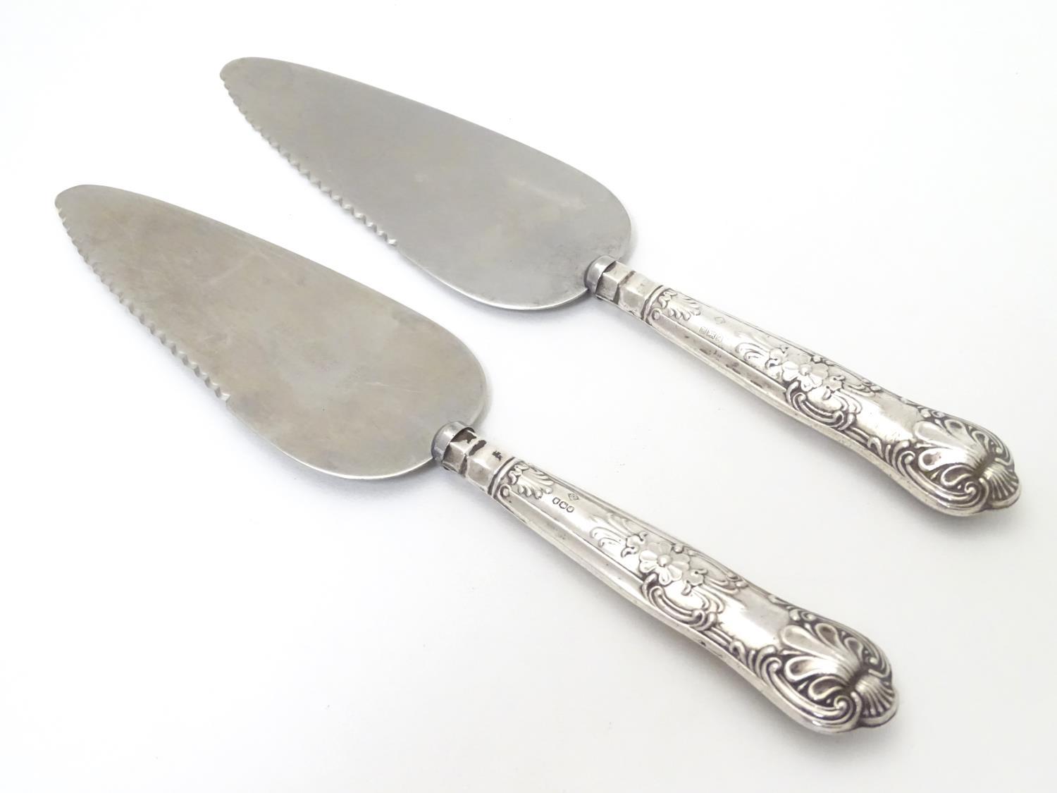 Two silver handled Kings pattern ' pie servers ' . Approx 10" long Please Note - we do not make