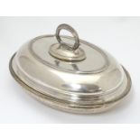 A Victorian silver plate lidded entree dish of oval form. Approx 12" wide Please Note - we do not