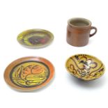 Four items of assorted ceramics to include two Poole pottery plates with incised fish decoration,