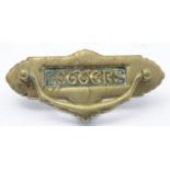 A Victorian brass letterbox with shaped surround. Approx. 8 1/2" long overall Please Note - we do