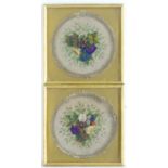 A pair of Victorian embroidered roundels with central floral relief composition, hand painted silk