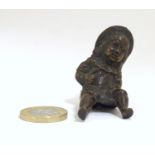 A late 19thC bronze modelled as a young girl with a hat. Approx. 2" Please Note - we do not make