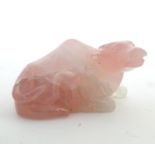 An Oriental carved rose quartz model of a buffalo. Approx. 3" long Please Note - we do not make