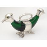 A novelty green glass decanter with twin spots , green glass body, formed as a ducks with silver