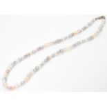 A coloured pearl necklace with silver clasp. Approx. 19" long Please Note - we do not make reference
