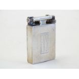 A mid 20thC lighter, stamped 'WM 1944' with chromed finish, 2 1/2@ tall Please Note - we do not make