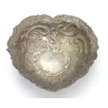 A silver heart shaped pin dish with embossed decoration. Hallmarked Birmingham 1994 maker WI