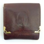 A Cartier small leather wallet / coin purse. Approx. 3 1/4" Please Note - we do not make reference