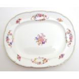 A 19thC Mintons oval serving plate with a lobed rim decorated with floral motifs and gilt